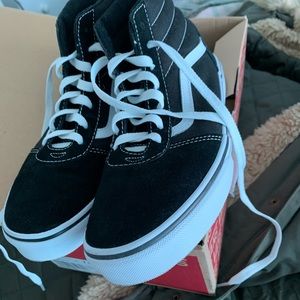 Size 7Y/9 in women’s high top vans. Worn once.